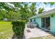 Back patio with spa and sliding glass doors providing access to the home's interior at 6773 Se 87Th St, Ocala, FL 34472