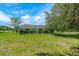 Spacious backyard featuring a hedge and views of neighboring properties at 6773 Se 87Th St, Ocala, FL 34472