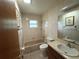Functional bathroom featuring a tub/shower combination, toilet, and vanity sink at 6773 Se 87Th St, Ocala, FL 34472