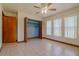 Bright bedroom features a closet, multiple windows, and tile flooring at 6773 Se 87Th St, Ocala, FL 34472
