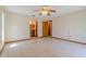 Spacious bedroom showcasing neutral decor and an ensuite bathroom at 6773 Se 87Th St, Ocala, FL 34472