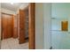 Hallway with storage and doorway, offering access to other areas of the home at 6773 Se 87Th St, Ocala, FL 34472