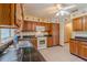 Large kitchen features ample cabinet space, and tile floors providing a functional cooking space at 6773 Se 87Th St, Ocala, FL 34472