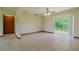 Open living space with sliding glass doors to the backyard and tile flooring at 6773 Se 87Th St, Ocala, FL 34472