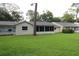 Exterior view of the house from the backyard showing the sunroom at 8655 Sw 98Th Street Rd # G, Ocala, FL 34481