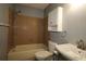 Bathroom features a shower-tub combo, a single sink, and a mirrored medicine cabinet at 8655 Sw 98Th Street Rd # G, Ocala, FL 34481
