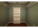 Walk-in closet with hardwood floors, shelving, and hanging rods at 8655 Sw 98Th Street Rd # G, Ocala, FL 34481
