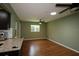 Living room with tile floors, a ceiling fan, and large windows allowing natural light to flood the space at 8655 Sw 98Th Street Rd # G, Ocala, FL 34481