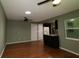 Bright and airy living room offering a ceiling fan and a seamless transition to the open-concept kitchen at 8655 Sw 98Th Street Rd # G, Ocala, FL 34481