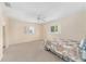 Bedroom featuring neutral carpet, natural lighting and a relaxing atmosphere at 8689 Se 141St Street Rd, Summerfield, FL 34491