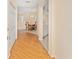 Inviting foyer with hardwood floors leading to a dining area and a glimpse of the kitchen at 8689 Se 141St Street Rd, Summerfield, FL 34491