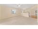 The spacious living room offers neutral carpet, natural light, and an inviting atmosphere at 8689 Se 141St Street Rd, Summerfield, FL 34491