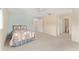Spacious main bedroom with neutral carpet and an en-suite bathroom at 8689 Se 141St Street Rd, Summerfield, FL 34491