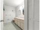 Bright bathroom with a vanity, mirror, and neutral colored walls at 8830 Sw 98Th Pl # M, Ocala, FL 34481