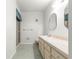 Well-lit bathroom with vanity, mirror, and shower at 8830 Sw 98Th Pl # M, Ocala, FL 34481