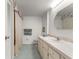 Well-lit bathroom with a vanity, updated fixtures, and a shower behind curtain for convenience at 8830 Sw 98Th Pl # M, Ocala, FL 34481