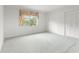 Bright bedroom with large windows and ample closet space, perfect for relaxation and storage at 8830 Sw 98Th Pl # M, Ocala, FL 34481