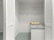 View of the closet with louvered doors, shelving, and built in storage at 8830 Sw 98Th Pl # M, Ocala, FL 34481