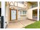 Close-up of an inviting front door with stone accents and well-maintained landscaping at 8830 Sw 98Th Pl # M, Ocala, FL 34481