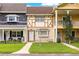 Charming townhouses featuring unique facades, manicured lawns, and inviting entrances at 8830 Sw 98Th Pl # M, Ocala, FL 34481