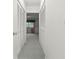 Hallway with closet space leads to a bedroom, providing ample storage and functional living at 8830 Sw 98Th Pl # M, Ocala, FL 34481