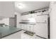 Bright kitchen featuring white cabinets and modern appliances at 8830 Sw 98Th Pl # M, Ocala, FL 34481