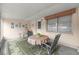 A view of a screened patio with outdoor seating, ideal for relaxing at 8830 Sw 98Th Pl # M, Ocala, FL 34481