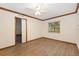 Bedroom with natural light, wood-look floors, and a ceiling fan at 8959 Sw 96Th Ln # A, Ocala, FL 34481