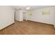 Large bedroom with wood grain flooring, windows, ceiling fan, and walk-in closet at 8959 Sw 96Th Ln # A, Ocala, FL 34481
