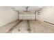 A two-car garage features neutral paint, shelving and an automatic overhead door at 8959 Sw 96Th Ln # A, Ocala, FL 34481
