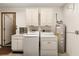 The garage laundry area features a utility sink, washer, dryer, and water heater at 8959 Sw 96Th Ln # A, Ocala, FL 34481