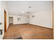 Spacious living room with wood-look floors, neutral walls and ceiling fan at 8959 Sw 96Th Ln # A, Ocala, FL 34481