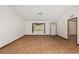 Living room features wood-look floors, ample natural light, and neutral walls at 8959 Sw 96Th Ln # A, Ocala, FL 34481