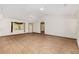 Bright living room featuring wood floors, a ceiling fan, and a large window with natural light at 8959 Sw 96Th Ln # A, Ocala, FL 34481