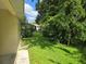 Lush backyard with verdant grass and mature shade trees at 8959 Sw 96Th Ln # A, Ocala, FL 34481