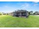 Large screened lanai and a well-maintained lawn, perfect for outdoor entertaining at 9222 Sw 97Th Cir, Ocala, FL 34481