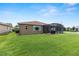 Large screened lanai and a well-maintained lawn, perfect for outdoor entertaining and relaxation at 9222 Sw 97Th Cir, Ocala, FL 34481