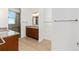 Bathroom featuring double granite sink, updated vanity, and tiled walk-in shower at 9222 Sw 97Th Cir, Ocala, FL 34481