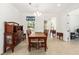Open dining area featuring a traditional hutch, wood dining set, and easy access to living spaces at 9222 Sw 97Th Cir, Ocala, FL 34481