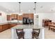 Spacious kitchen features granite counters, center island, tile floors, and stainless steel appliances at 9222 Sw 97Th Cir, Ocala, FL 34481