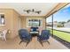 Screened patio featuring comfortable seating, ceiling fans, and view of neighborhood at 9222 Sw 97Th Cir, Ocala, FL 34481