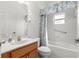 Bright bathroom featuring a tub with shower, a vanity with a sink, and coordinated decor for a clean and functional space at 9746 Sw 89Th Loop, Ocala, FL 34481