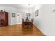 Cozy dining area adjacent to kitchen, featuring hardwood floors and natural light at 9746 Sw 89Th Loop, Ocala, FL 34481