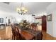 Elegant dining room featuring a wooden table, decorative accents, and access to the living area at 9746 Sw 89Th Loop, Ocala, FL 34481