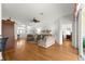 Spacious living room featuring hardwood floors, a ceiling fan, and a sliding glass door at 9746 Sw 89Th Loop, Ocala, FL 34481