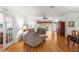 Spacious living room with hardwood floors, comfortable furniture, and access to the outdoors at 9746 Sw 89Th Loop, Ocala, FL 34481