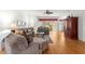 Inviting living room with plush seating, hardwood floors, and large windows for natural light at 9746 Sw 89Th Loop, Ocala, FL 34481
