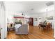 Open-concept living room with hardwood floors, dining area, and comfortable seating at 9746 Sw 89Th Loop, Ocala, FL 34481