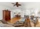 Open-concept living room featuring an ample seating area and hardwood floors at 9746 Sw 89Th Loop, Ocala, FL 34481