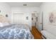 Comfortable bedroom with hardwood floors and a closet, creating a relaxing retreat at 9746 Sw 89Th Loop, Ocala, FL 34481